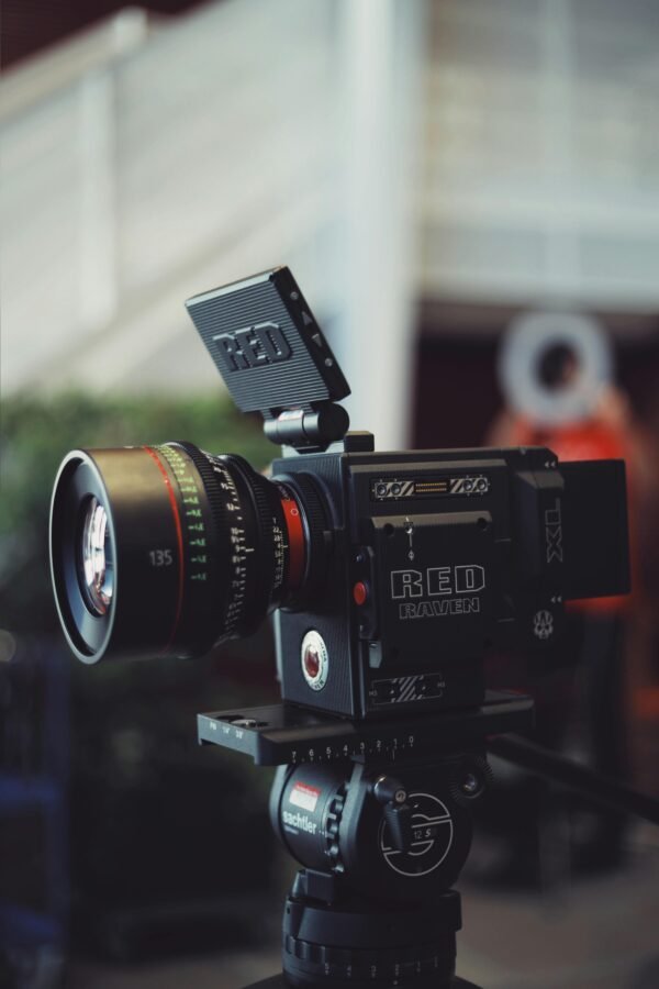 Close-up of a RED Raven video camera on a tripod, perfect for filmmaking and video production.